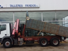 Used truck IVECO MH260E31/TN, 6x2, with tipper box and crane Fassi 195A.24 of 5 hydraulic arms and 2 manuals, with remote control, crane year 2005.